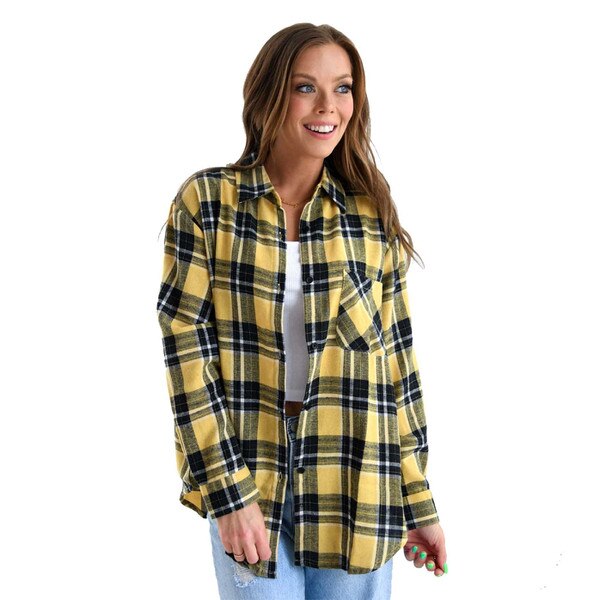 This is the front of a black, yellow, and white large print buffalo plaid shirt. There's a pocket on the left chest. The fit is oversized.